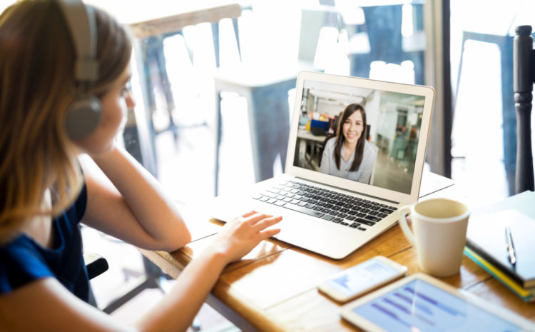 featured image of a women engaging in a video conference while working from home