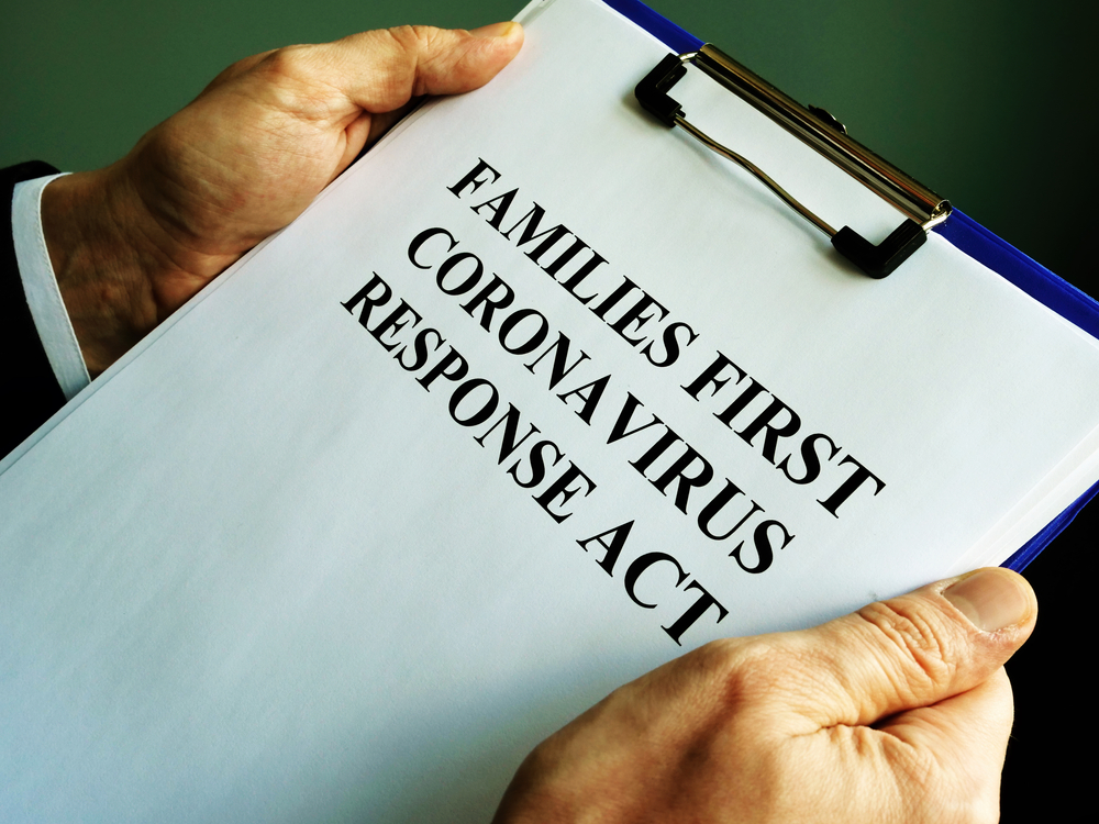 featured image showing a businessman reads families first coronavirus response act FFCRA
