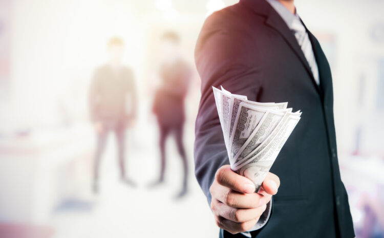 featured image showing Businessman with money in hand.
