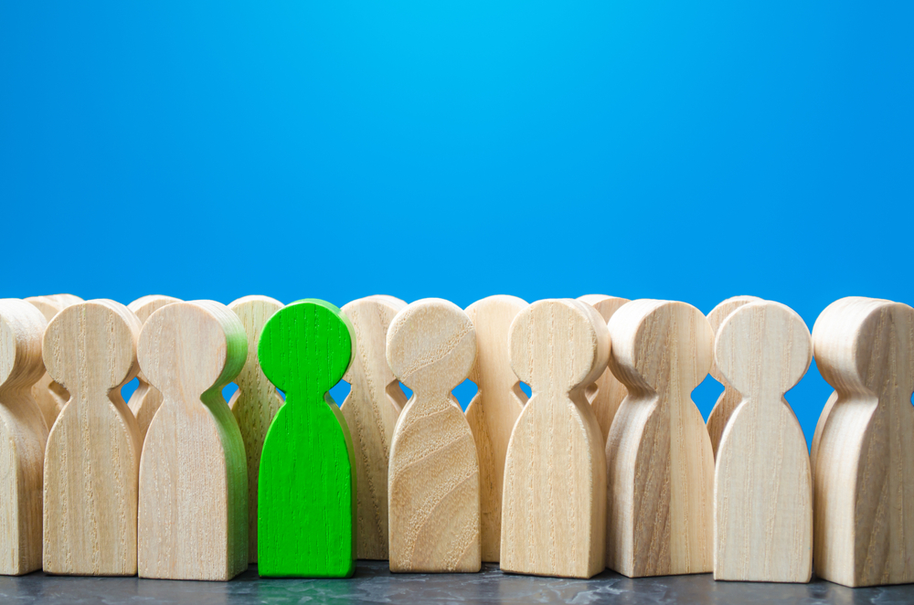 featured image showing wooden characters to symbolize employee job search