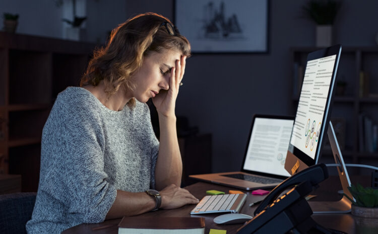 featured image showing a business woman working from home after hours